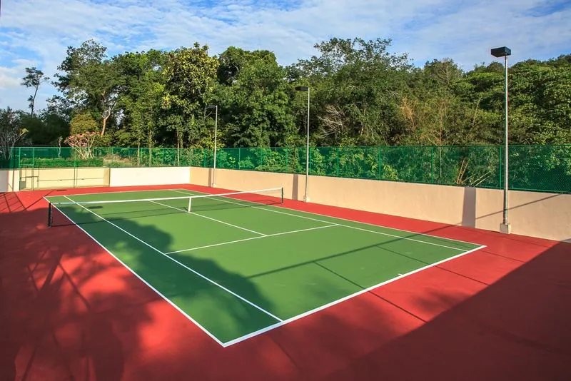 Outdoor tennis court in greenery
