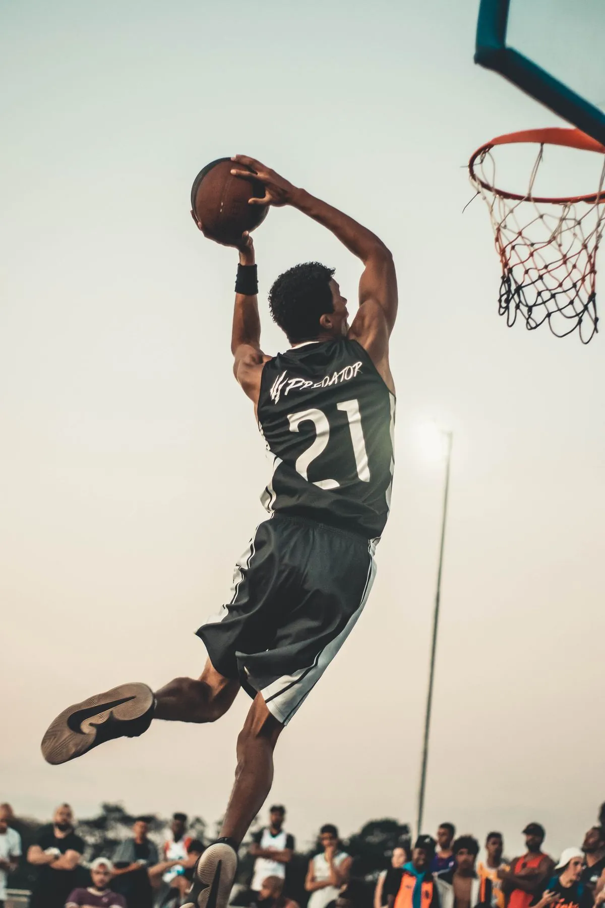 Athlete dunking a basketball
